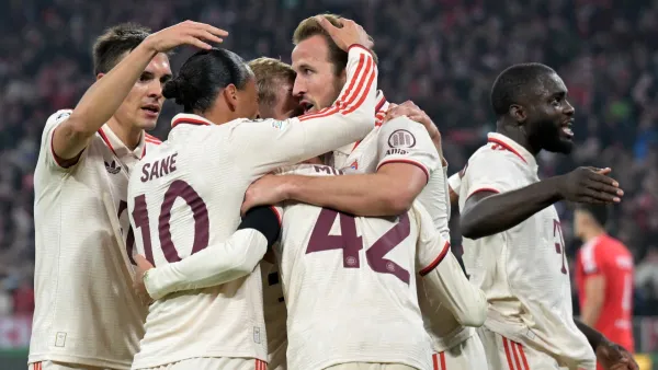 Bayern Munich's German midfielder #42 Jamal Musiala (C) celebrates with teammates after scoring the 1-0 opening goal during the UEFA Champions League football match FC Bayern Munich vs SL Benfica in Munich, southern Germany, on November 6, 2024. (Photo by Tobias SCHWARZ / AFP)