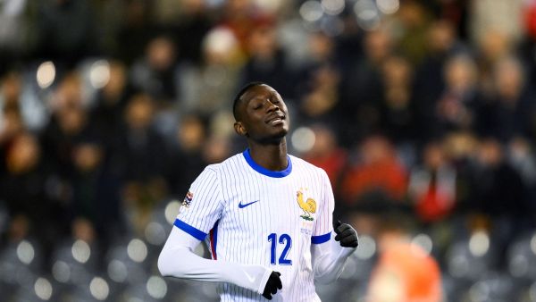 France's forward #12 Randal Kolo Muani reacts after missing a goal opportunity during the UEFA Nations League League A, Group A2 football match between Belgium and France, at the King Baudouin Stadium in Brussels, on October 14, 2024. (Photo by JOHN THYS / AFP)