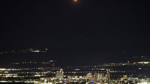 This picture taken from the Israeli port city of Haifa shows an explosion (top C) as Israel's Iron Dome air defence system intercepts rockets fired from Lebanon over northern Israel, on November 26, 2024, amid the ongoing war between Israel and Hezbollah. AFP Explosions rock Haifa
