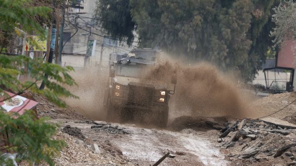  Israeli military vehicle deploys during a large-scale Israeli army raid in Jenin
