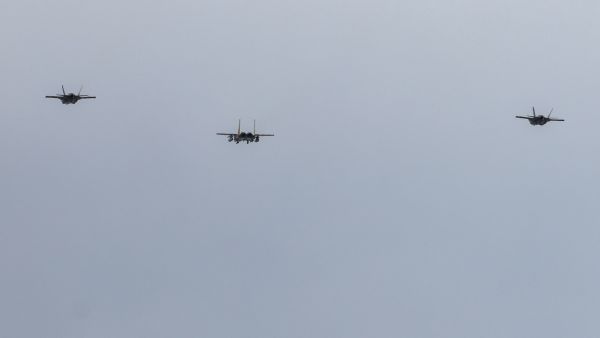Israeli Air Force F-15 and F-35 fighter aircraft fly over Camille Chamoun Sports City Stadium 