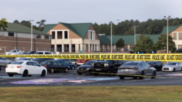 Police tape surrounds the perimeter of Apalachee High School on September 5, 2024 in Winder, Georgia. AFP 9 shot in mass shooting at US Arizona restaurant; suspects at large