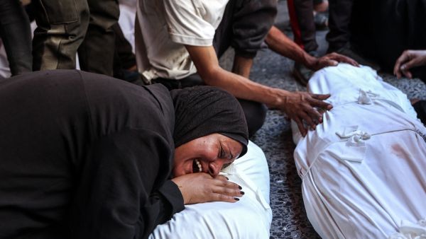 Israeli strikes hit café, charging station in Gaza, killing dozens of civilians