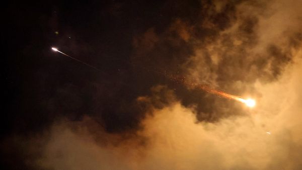 Rocket trails are seen in the sky above the Israeli coastal city of Netanya amid a fresh barrage of Iranian missile attacks on June 21, 2025. Israel's war with Iran entered its second week with the Israeli military chief warning of a "prolonged campaign" and Tehran ruling out further nuclear talks with the United States until Israel halts its attacks. (Photo by JACK GUEZ / AFP) Revealed: The IRGC commander orchestrating global attacks on Israeli targets