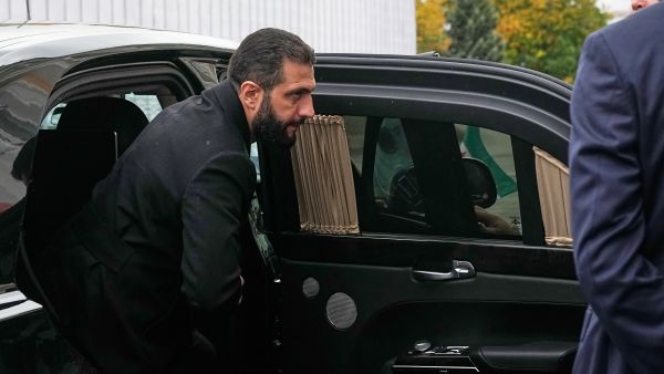 Syrian interim president Ahmed al-Sharaa arrives at the Grand Kremlin Palace for his meeting with Russian President in Moscow on October 15, 2025. (Photo by Pavel Bednyakov / POOL / AFP) al sharaa