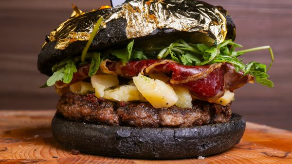 Artisanal black sandwich filled with meat burgers