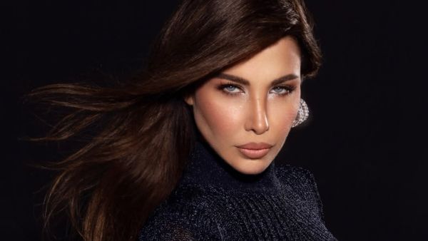 نانسي عجرم تتألق بفستان أسود شفاف من إيلي صعب في زفاف نجل محمد عبده
