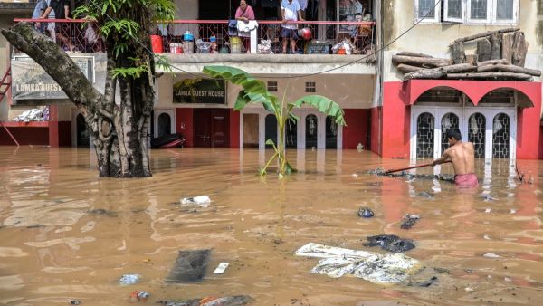 150 dead as unseasonal rains trigger floods and landslides in India and Nepal