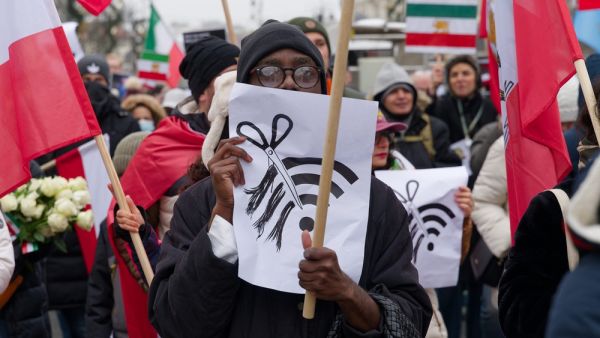 Protestor holds a sign
