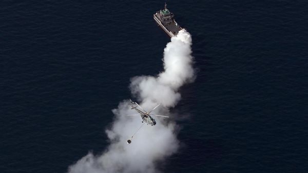 Crew rescued after sanctioned tanker catches fire in suspected attack off Oman
