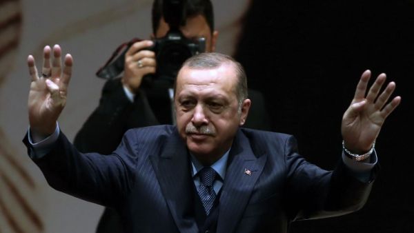 Turkey's President and leader of the Justice and Development Party (AKP) Recep Tayyip Erdogan gestures during the AKP's extended meeting of provincial heads at the party's headquarters in Ankara on Feb. 23, 2018. 
(ADEM ALTAN / AFP)