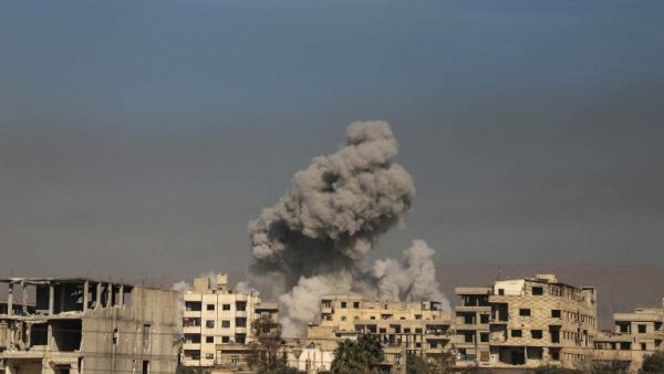 A general view shows smoke billowing in Hazeh, in the rebel enclave of Eastern Ghouta on the outskirts of Damascus on Mar. 15, 2018 during reported shelling by Syrian government forces. Seven years of conflict in Syria have left more than 350,000 people dead, according to an updated overall death toll released today by the Syrian Observatory for Human Rights.
(AMER ALMOHIBANY / AFP)