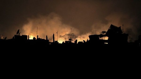 A picture taken early on Mar. 23, 2018 shows flames erupting following regime bombardment in Douma, one of the few remaining rebel-held pockets in Eastern Ghouta on the outskirts of the capital Damascus. 
(HAMZA AL-AJWEH / AFP)