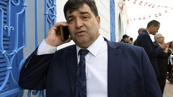 Rene Trabelsi speaks on the phone outside the Ghriba Synagogue on the Tunisian resort island of Djerba. (FETHI BELAID / AFP)