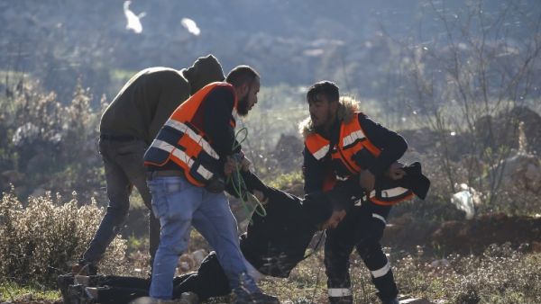 Palestinian medics evacuate a wounded Palestinian protester during clashes between Israeli troops and Palestinian demonstrators in Ramallah. (AFP)