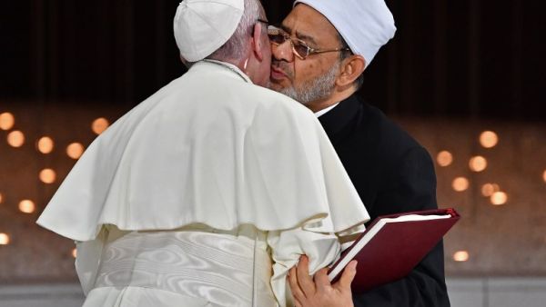 Pope Francis (L) and Egypt's Azhar Grand Imam Sheikh Ahmed al-Tayeb greet each other as they exchange documents during the Human Fraternity Meeting at the Founders Memorial in Abu Dhabi on February 4, 2019. 
Vincenzo PINTO / AFP