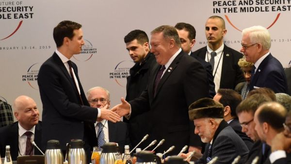 White House US Senior Advisor Jared Kushner (L) shakes hands with US Secretary of State Mike Pompeo as they arrive for a session at the conference on Peace and Security in the Middle east in Warsaw, on February 14, 2019. 
Janek SKARZYNSKI / AFP