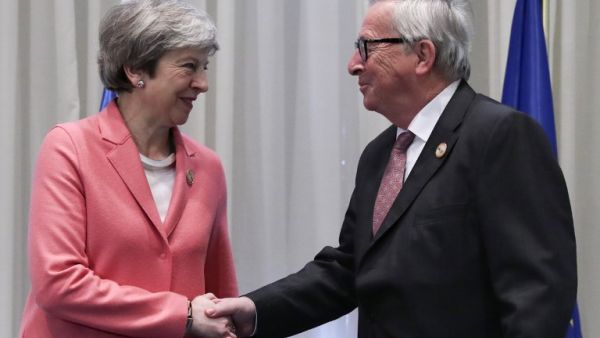 Britain's Prime Minister Theresa May (L) greets the European Commission President Jean-Claude Juncker during a meeting on the sidelines of the the first joint European Union and Arab League summit. (AFP/ File)
