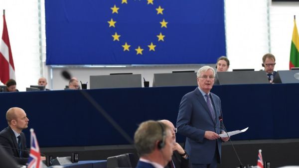 European Union's chief Brexit negotiator Michel Barnier (R) speaks during a debate on the preparation of the upcoming European Council meeting of March 21 and 22 and UK’s withdrawal from the EU. (AFP)