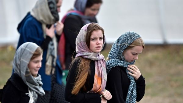 Residents and schoolchildren wearing headscarves arrive for the funeral of those killed in New Zealand's twin mosque attacks at Memorial Park cemetery in Christchurch on March 21, 2019. (AFP/ File)