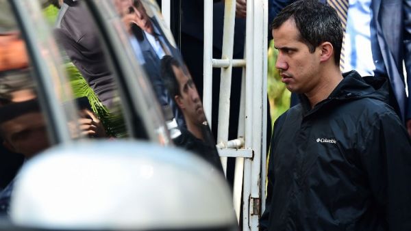 Venezuelan opposition leader and self-proclaimed interim president Juan Guaido leaves the residence of his Chief of Staff Roberto Marrero, who was arrested during a raid early March 21, 2019. (AFP)