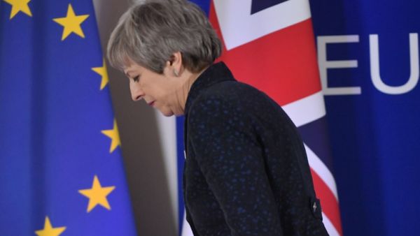 British Prime Minister Theresa May walks after holding a press conference on March 22, 2019, on the first day of an EU summit focused on Brexit, in Brussels. (Emmanuel DUNAND / AFP)