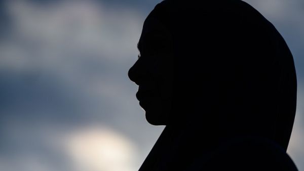 A woman attends a vigil in memory of the twin mosque massacre victims in Christchurch (AFP)