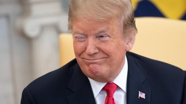 US President Donald Trump winks during a meeting with Israeli Prime Minister Benjamin Netanyahu in the Oval Office at the White House in Washington, DC, March 25, 2019. (SAUL LOEB / AFP)