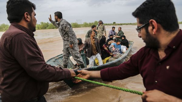 ranian soldiers help civilians in a flooded area in a village around the city of Ahvaz, in Iran's Khuzestan province (AFP)