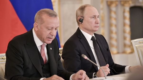 Turkish Presiddent Recep Tayyip Erdogan, (L) speaks next to Russian President Vladimir Putin during a meeting with Russian and Turkish businessmen at the Kremlin in Moscow on April 8, 2019. (Alexey NIKOLSKY / Sputnik / AFP)