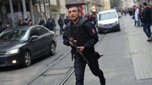 A Turkish policeman runs after an explosion on the pedestrian Istiklal avenue in Istanbul on March 19, 2016. Two people, including the bomber, were killed and six others injured in a suicide attack on a major shopping street in Istanbul on Saturday, Turkey's CNN-Turk television reported. (AFP/File)
Bulent KILIC / AFP