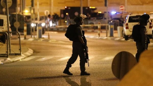 A Israeli soldier walks on the street with weapon at the ready (AFP/File Photo)	