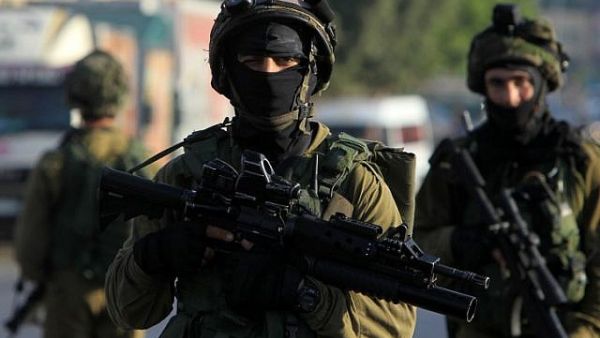 Palestinian security sources said more than 20 Israeli military jeeps raided the Surra village following the attack in search of the shooters (AFP/File)