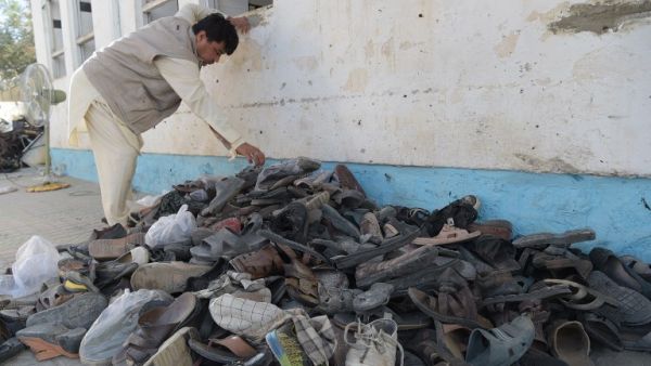 Footwear belonging to victims of a suicide attack on a Shiite mosque are seen in a pile outside the mosque premises a day after the attack, in Kabul on August 26, 2017. A suicide bomb and gun attack claimed by the Islamic State group on a Shiite mosque in Kabul killed 20 people and wounded scores more on August 25, officials said, the latest assault to highlight deteriorating security in Afghanistan.  (AFP)