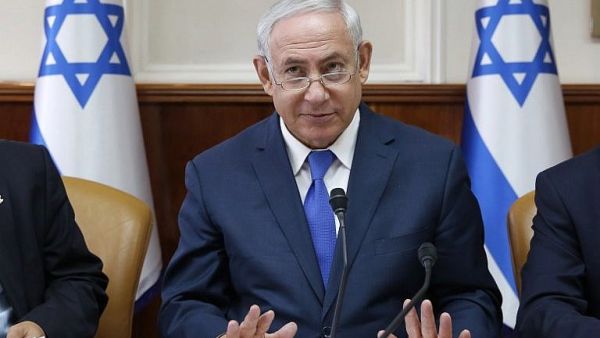 The prime minister’s comments came as Bitan publicly said he would call an election if coalition partners do not support the bill (AFP/File)