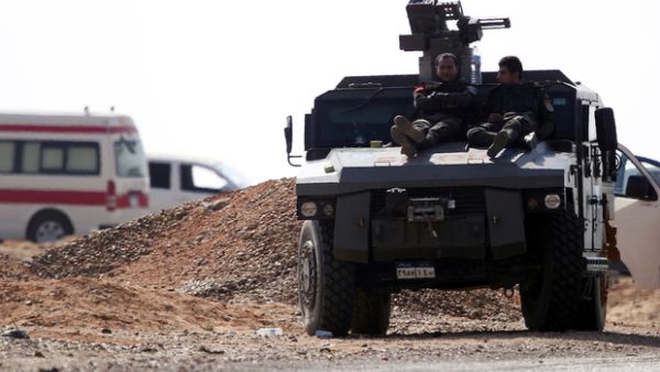 Members of Egyptian security forces resting on top of an armoured vehicle ( AFP)
