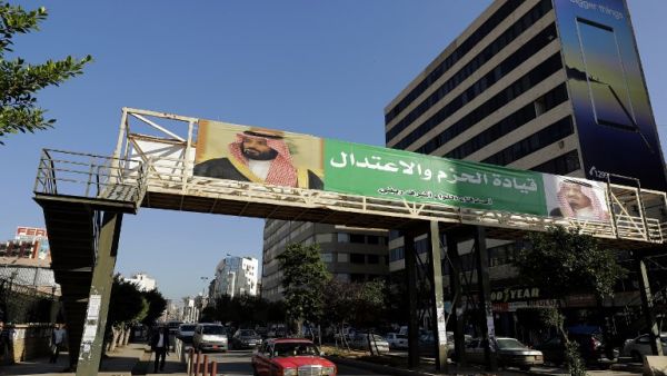  banner bearing the images of Saudi King Salman bin Abdulaziz (R) and Crown Prince Mohammed bin Salman (L) hangs on a pedestrian crossing bridge in the northern Lebanese port city of Tripoli. The caption in Arabic says: "firm and moderating leadership". (JOSEPH EID / AFP)