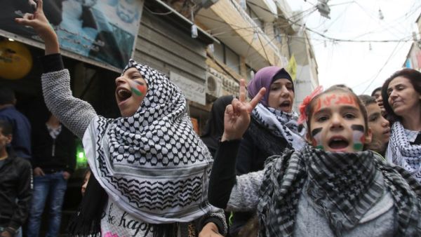 Palestinian women and children take part in a protest in the refugee camp of Ain el-Helwe on the outskirts of the southern Lebanese port city of Sidon Dec. 8, 2017 to denounce the widely criticised U.S. decision to recognize Jerusalem as the capital of Israel (Mahmoud Zayyat/AFP)