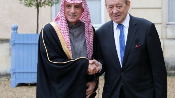 Saudi foreign affairs minister Adel Al Jubeir (L) is welcomed by French foreign affairs minister Jean Yves Le Drian upon his arrival for a summit from the underfunded G5 Sahel anti-terror coalition on Dec. 13, 2017 (Ludovic MARIN/AFP)