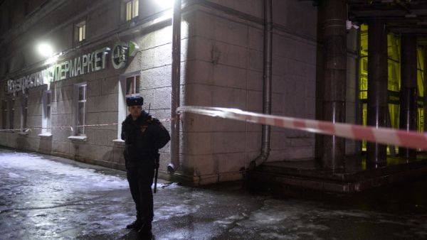 A police officer cordons off the site of a blast in a supermarket in Saint Petersburg on Dec. 27, 2017. 
(Olga MALTSEVA / AFP)