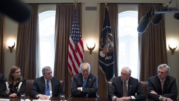 US President Donald Trump (C) listens during a meeting with bipartisan members of the Senate on immigration at the White House in Washington, DC, on Jan. 9, 2018 (JIM WATSON / AFP)