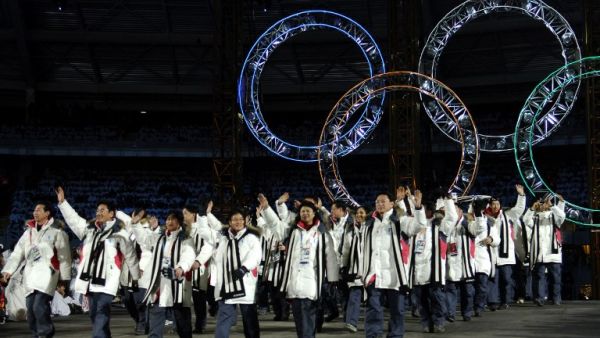 This file photo taken on Feb. 10, 2006 shows South Korean and North Korean athletes marching together during the opening ceremony of the 2006 Winter Olympics at the Olympic stadium in Turin (Eric Feferberg / AFP)