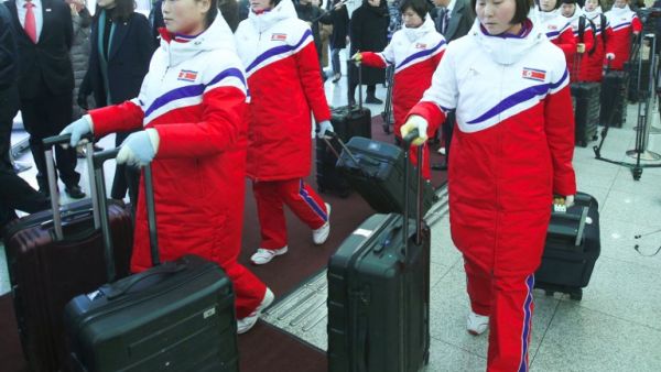 North Korea's women's ice hockey players who will form a unified Korean team at the Pyeongchang Winter Olympics arrive at the inter-Korea transit office near the Demilitarized zone dividing the two Koreas in Paju on Jan. 25, 2018 (KOREA POOL / AFP)