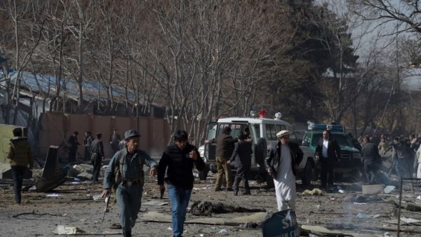 Afghan volunteers and policemen carry injured men on an ambulance at the scene of a car bomb exploded in front of the old Ministry of Interior building in Kabul on January 27, 2018. An ambulance packed with explosives blew up in a crowded area of Kabul on January 27, killing at least 17 people and wounding 110 others, officials said, in an attack claimed by the Taliban. 
(WAKIL KOHSAR / AFP)