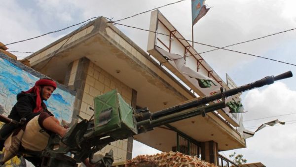 A fighter from the separatist Southern Transitional Council sits on the back of an armed vehicle after they took control of a pro-government position in the Dar Saad district in the north of Aden on Jan. 31, 2018 (SALEH AL-OBEIDI / AFP)