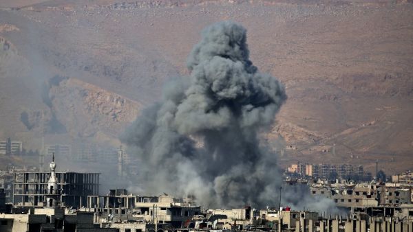 Smoke billows from an area that was targeted by Syrian government forces air strikes in the rebel-held town of Arbin, on the outskirts of the Syrian capital Damascus, on Feb. 1, 2018. Douma is in the Eastern Ghouta region which has been under government siege since 2013.
(ABDULMONAM EASSA / AFP)