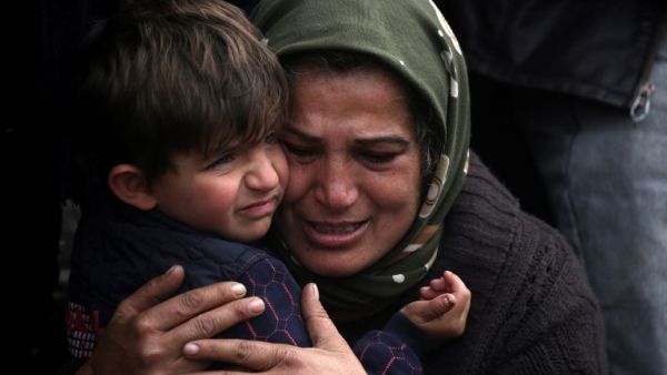 Syrian Kurds mourn in the northern town of Afrin during the funeral on Feb. 1, 2018 of fighters from the People's Protection Units (YPG) militia and the Women's Protection Units (YPJ), killed in clashes in the Kurdish enclave in northern Syria on the border with Turkey (DELIL SOULEIMAN / AFP)