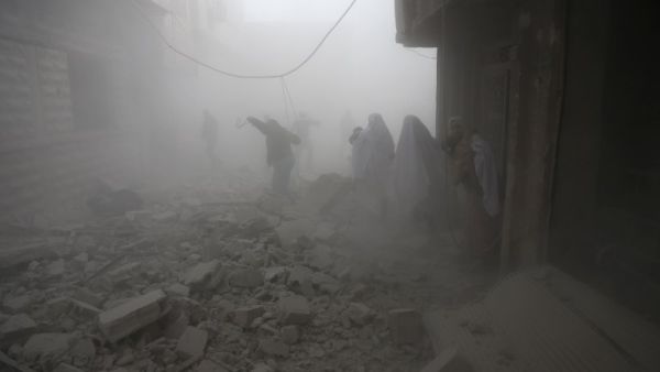 Syrian flee their homes following an airstrike in the rebel-held besieged town of Arbin, in the eastern Ghouta region on the outskirts of the capital Damascus on Feb. 2, 2018. 
(ABDULMONAM EASSA / AFP)