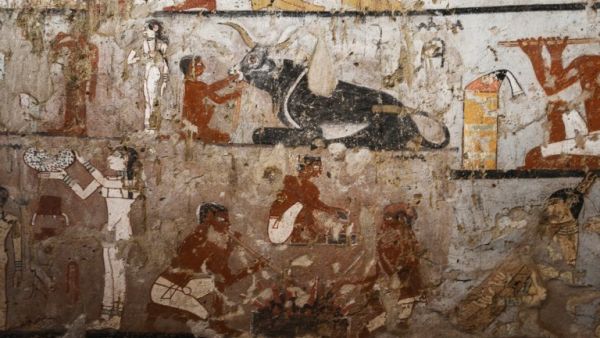 A general view shows well-preserved and rare wall paintings inside the tomb of an Old Kingdom priestess on the Giza plateau on the southern outskirts of Cairo, that was unveiled on Feb. 3, 2018 (MOHAMED EL-SHAHED / AFP)