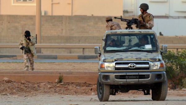 Libyans loyal to the LNA patrolling Benghazi in 2014. (AFP/File)